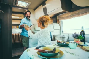 Couple living off grid inside a modern luxury caravan